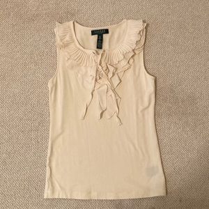 Cream sleeveless blouse with pleated ruffle collar and tie closure